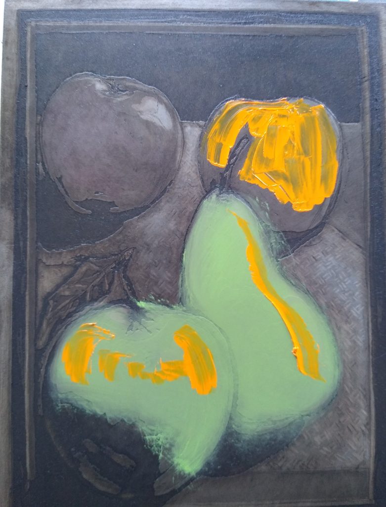 Close-up of a steel etching plate during à la poupée inking, showing yellow and ochre tones applied to apples in a still life print.