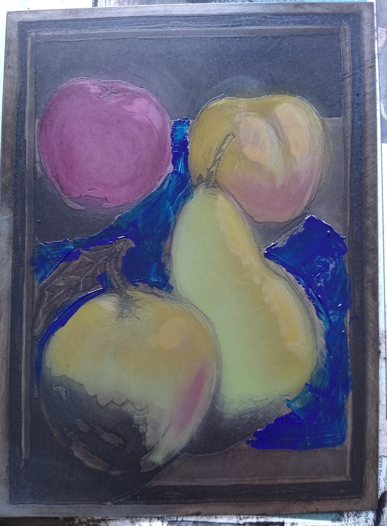 Final stage of à la poupée inking on a steel etching plate with bold blue background surrounding fruit in a still life composition.
